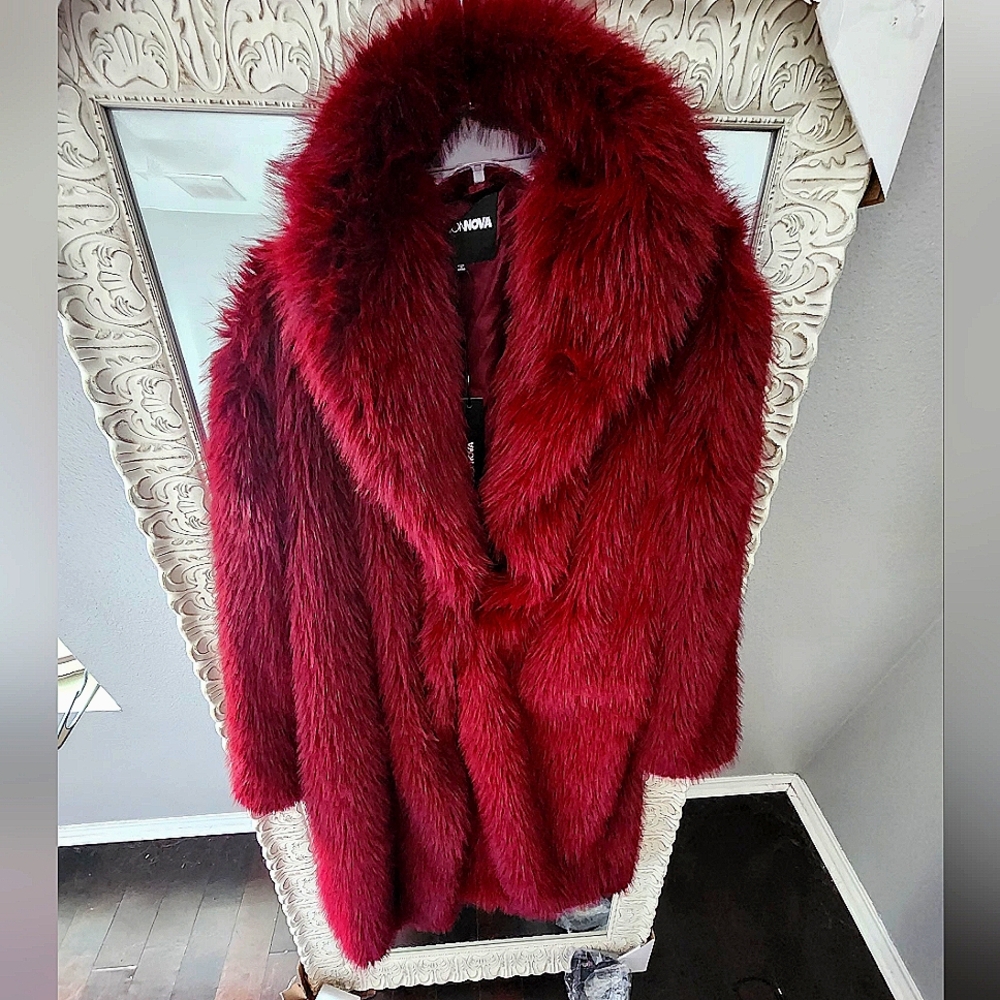 A burgundy big faux fur coat